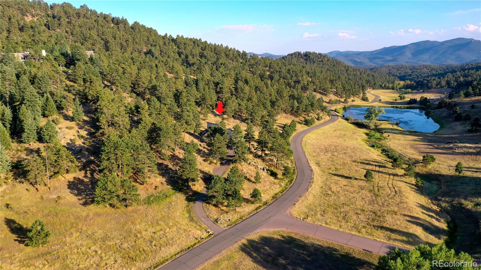 734 Spring Ranch Drive Golden, CO 80401 - Photo 33 of 40 a view of a lake with a mountain