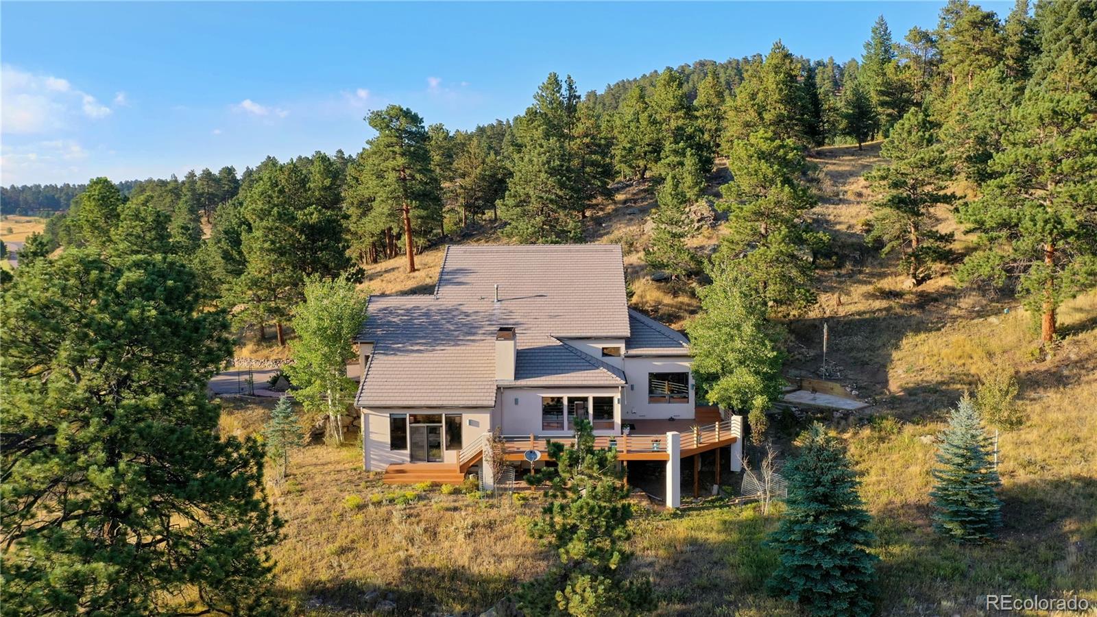 734 Spring Ranch Drive Golden, CO 80401 - Photo 34 of 40 aerial view of a house with a garden