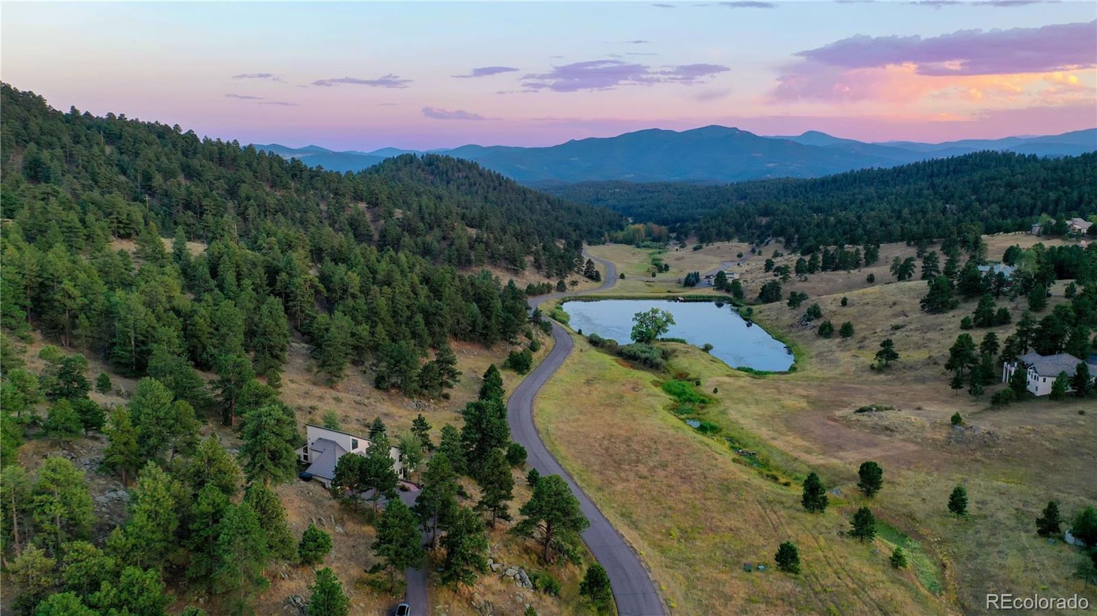 734 Spring Ranch Drive Golden, CO 80401 - Photo 39 of 40 a view of a lake with a mountain