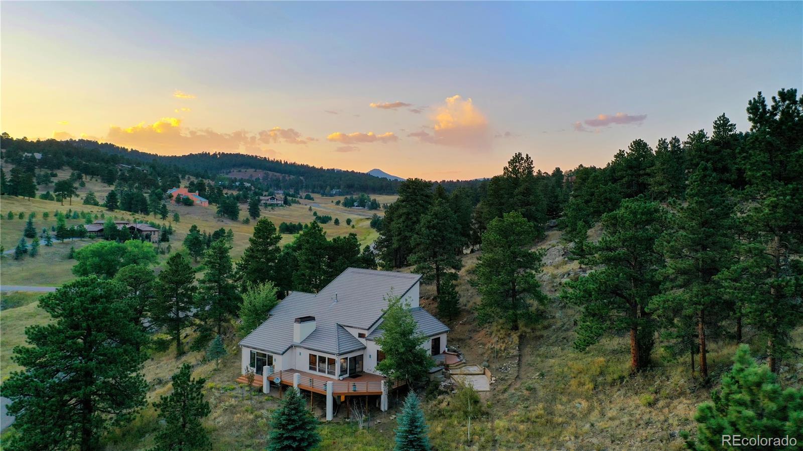 734 Spring Ranch Drive Golden, CO 80401 - Photo 40 of 40 an aerial view of a house with mountain view