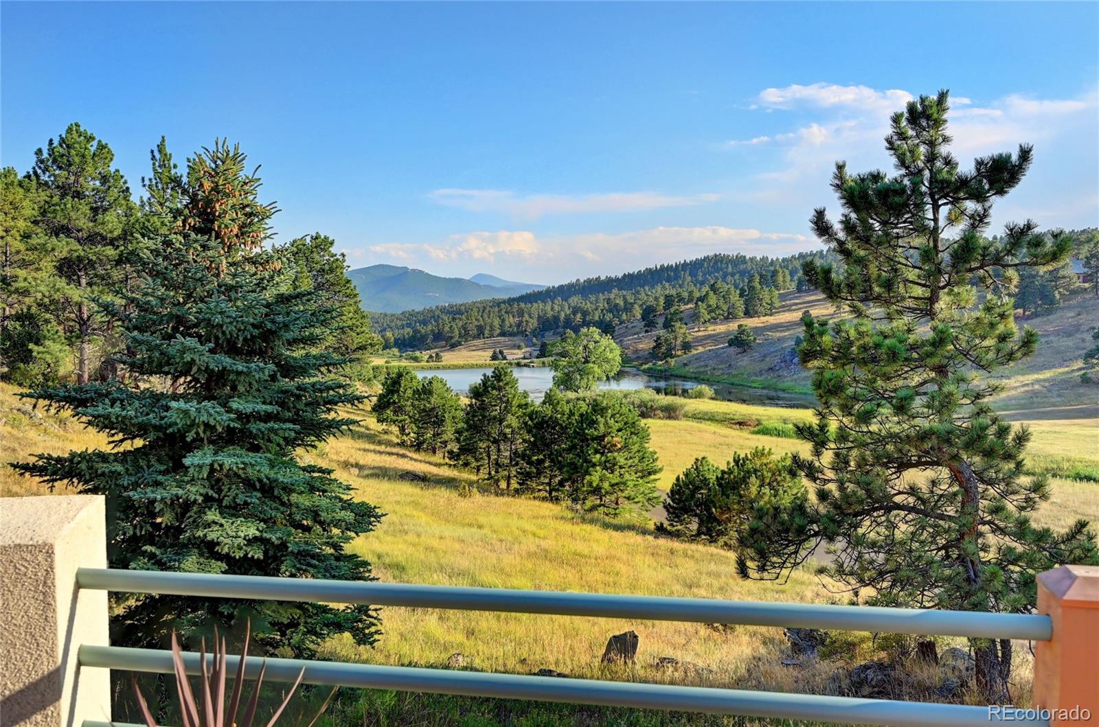 734 Spring Ranch Drive Golden, CO 80401 - Photo 4 of 40 a view of a lake from a balcony