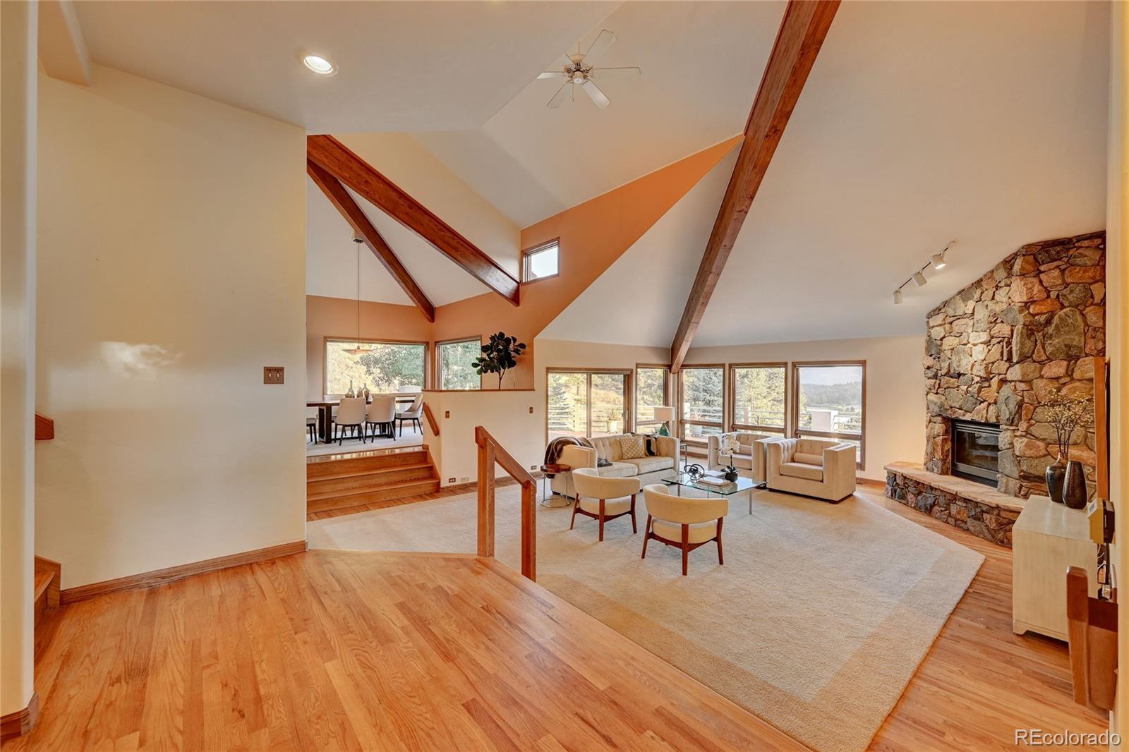 734 Spring Ranch Drive Golden, CO 80401 - Photo 8 of 40 a view of a dining room with furniture window and wooden floor