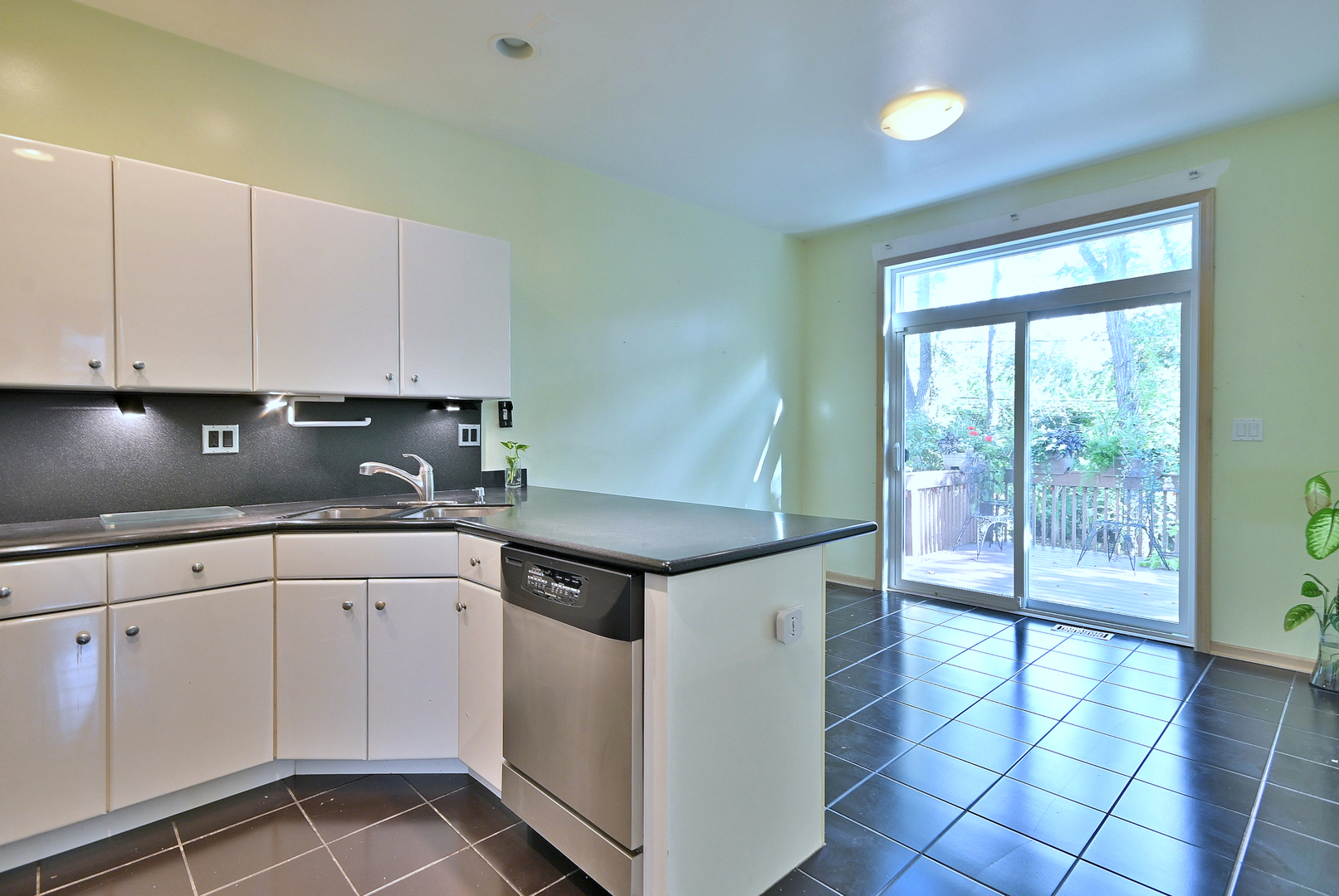 1735 Park Ridge Point Park Ridge, IL 60068 - Photo 26 of 64 a kitchen with stainless steel appliances granite countertop a stove a sink and white cabinets