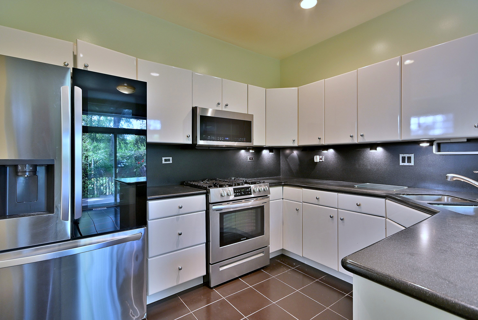 1735 Park Ridge Point Park Ridge, IL 60068 - Photo 28 of 64 a kitchen with granite countertop a stove sink and cabinets