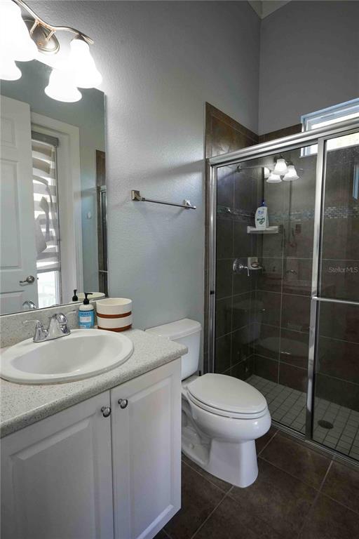 6219 Tiroco Way Windermere, FL 34786 - Photo 13 of 41 a bathroom with a sink a toilet and shower