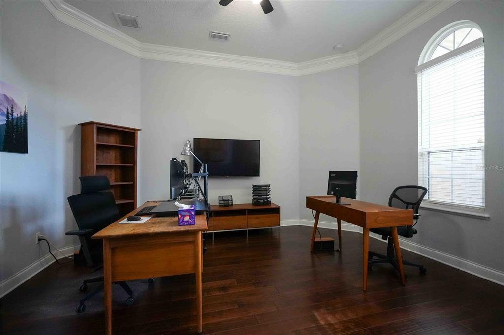6219 Tiroco Way Windermere, FL 34786 - Photo 17 of 41 a reading room with furniture wooden floor and a window
