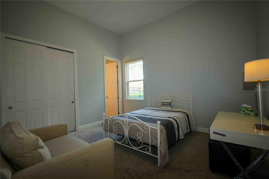 6219 Tiroco Way Windermere, FL 34786 - Photo 18 of 41 a bedroom with a bed and a couch