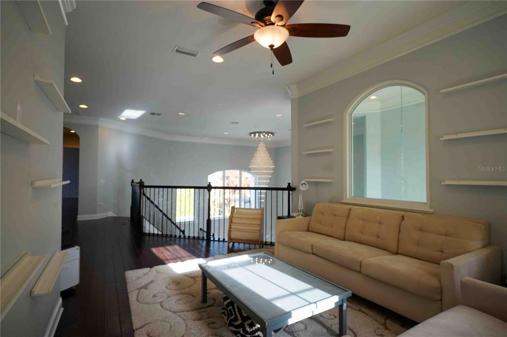 6219 Tiroco Way Windermere, FL 34786 - Photo 22 of 41 a living room with furniture and a ceiling fan