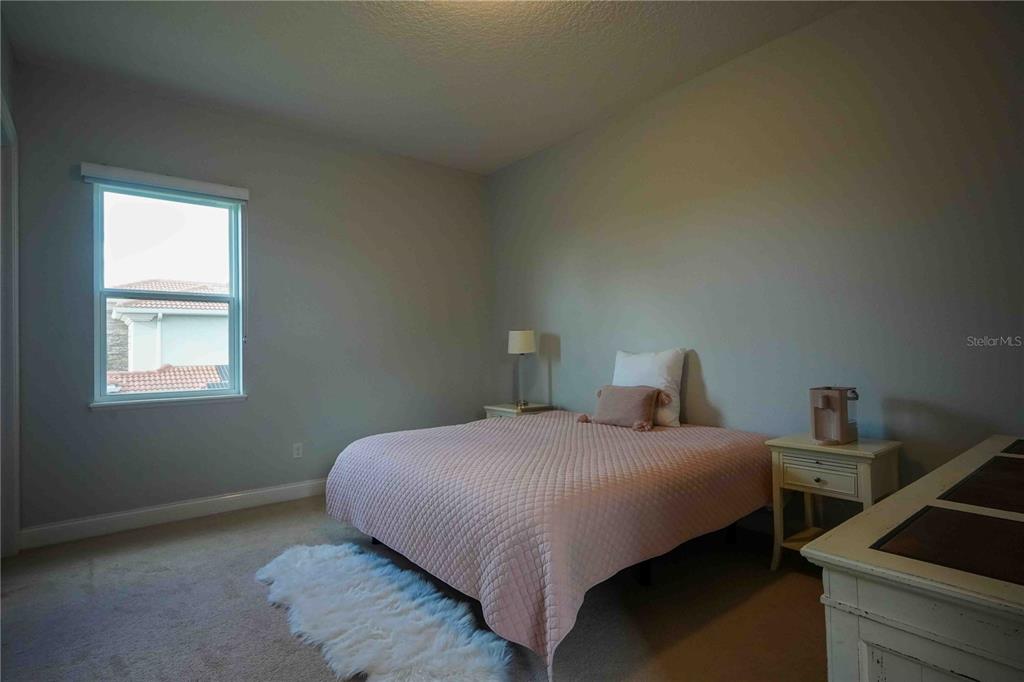 6219 Tiroco Way Windermere, FL 34786 - Photo 23 of 41 a bedroom with a bed and window