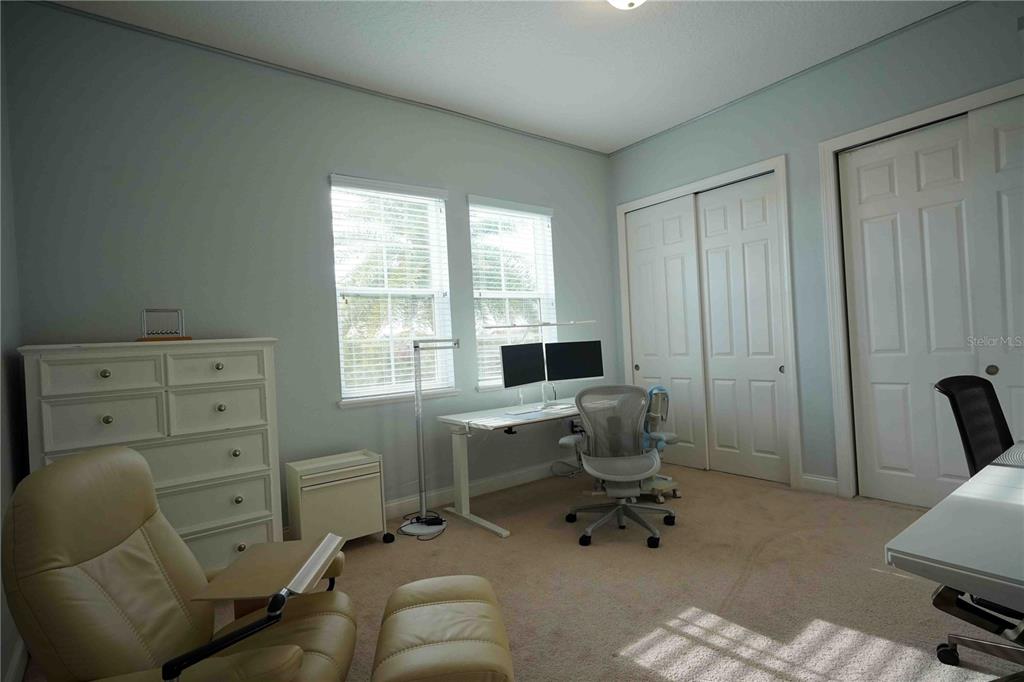 6219 Tiroco Way Windermere, FL 34786 - Photo 25 of 41 a view of a workspace with furniture and a window