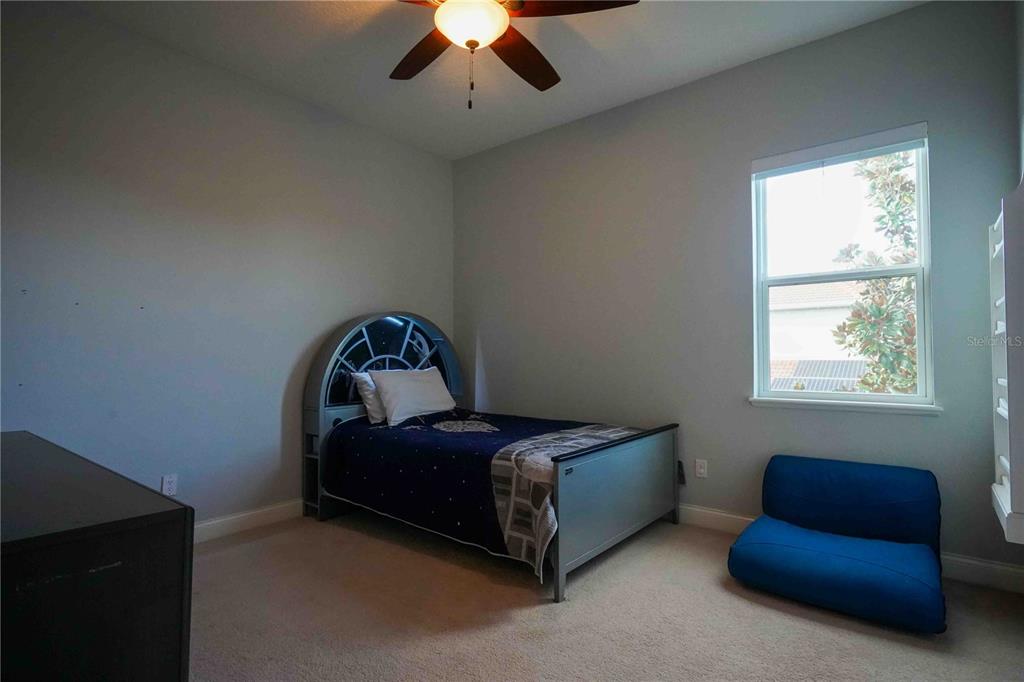 6219 Tiroco Way Windermere, FL 34786 - Photo 26 of 41 a bedroom with bed and a window