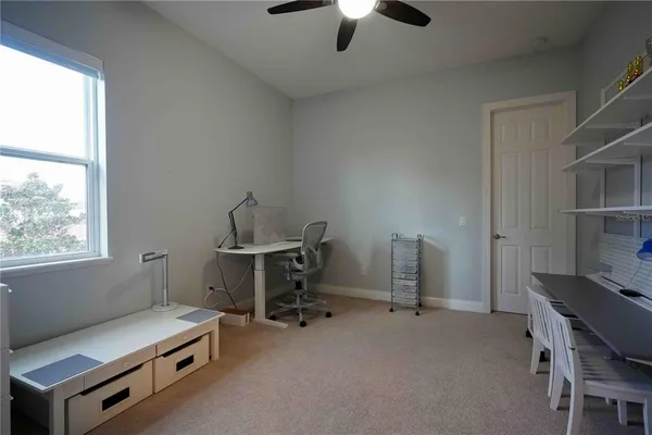 a room with gym equipment and a window