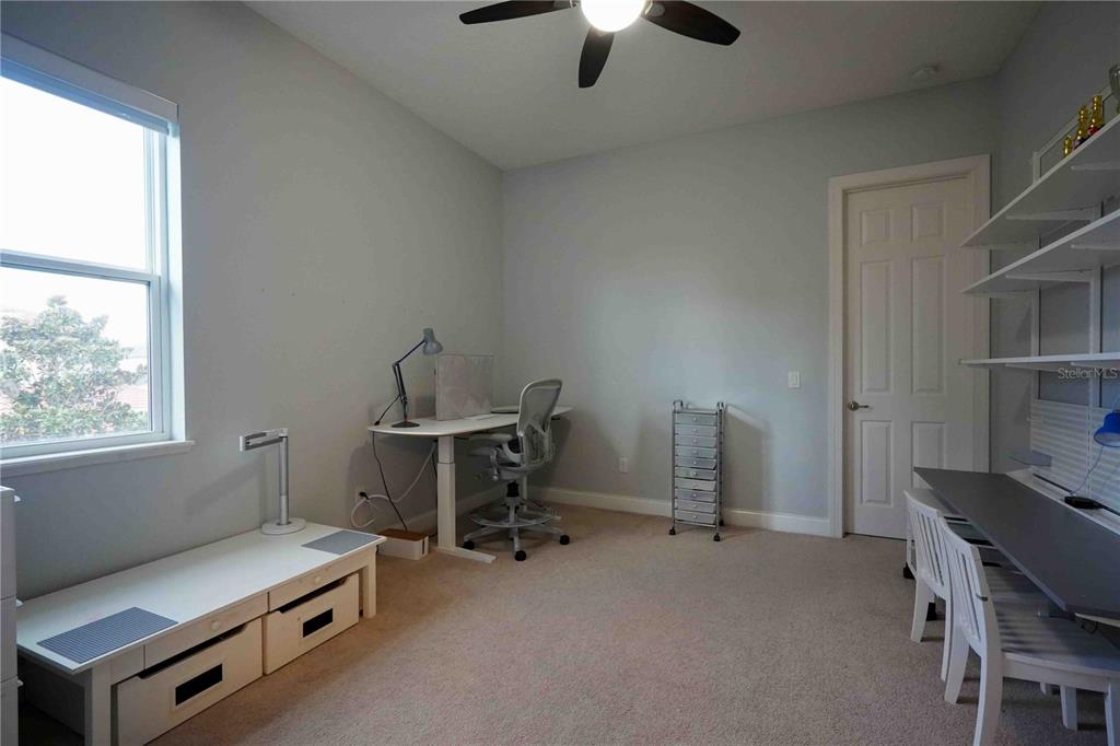 6219 Tiroco Way Windermere, FL 34786 - Photo 28 of 41 a room with gym equipment and a window