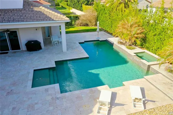a view of an outdoor space with a swimming pool