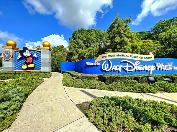 a view of outdoor space with sign board and garden