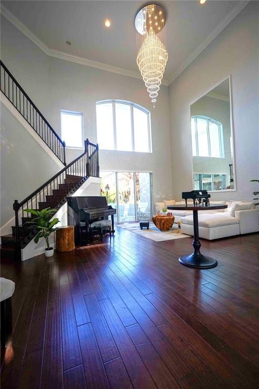 6219 Tiroco Way Windermere, FL 34786 - Photo 5 of 41 a living room with furniture and a wooden floor