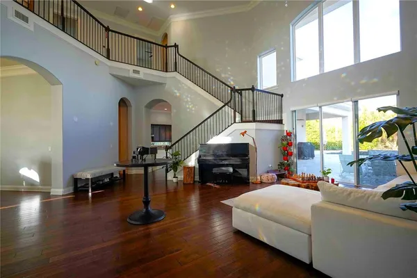 a view of living room with furniture and wooden floor