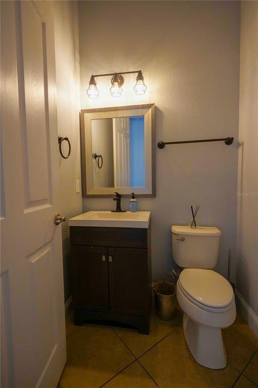 6219 Tiroco Way Windermere, FL 34786 - Photo 9 of 41 a bathroom with a toilet sink and mirror