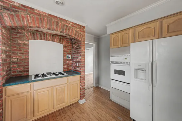 a kitchen with stainless steel appliances a stove and a refrigerator