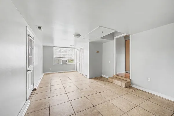 a view of an empty room and window