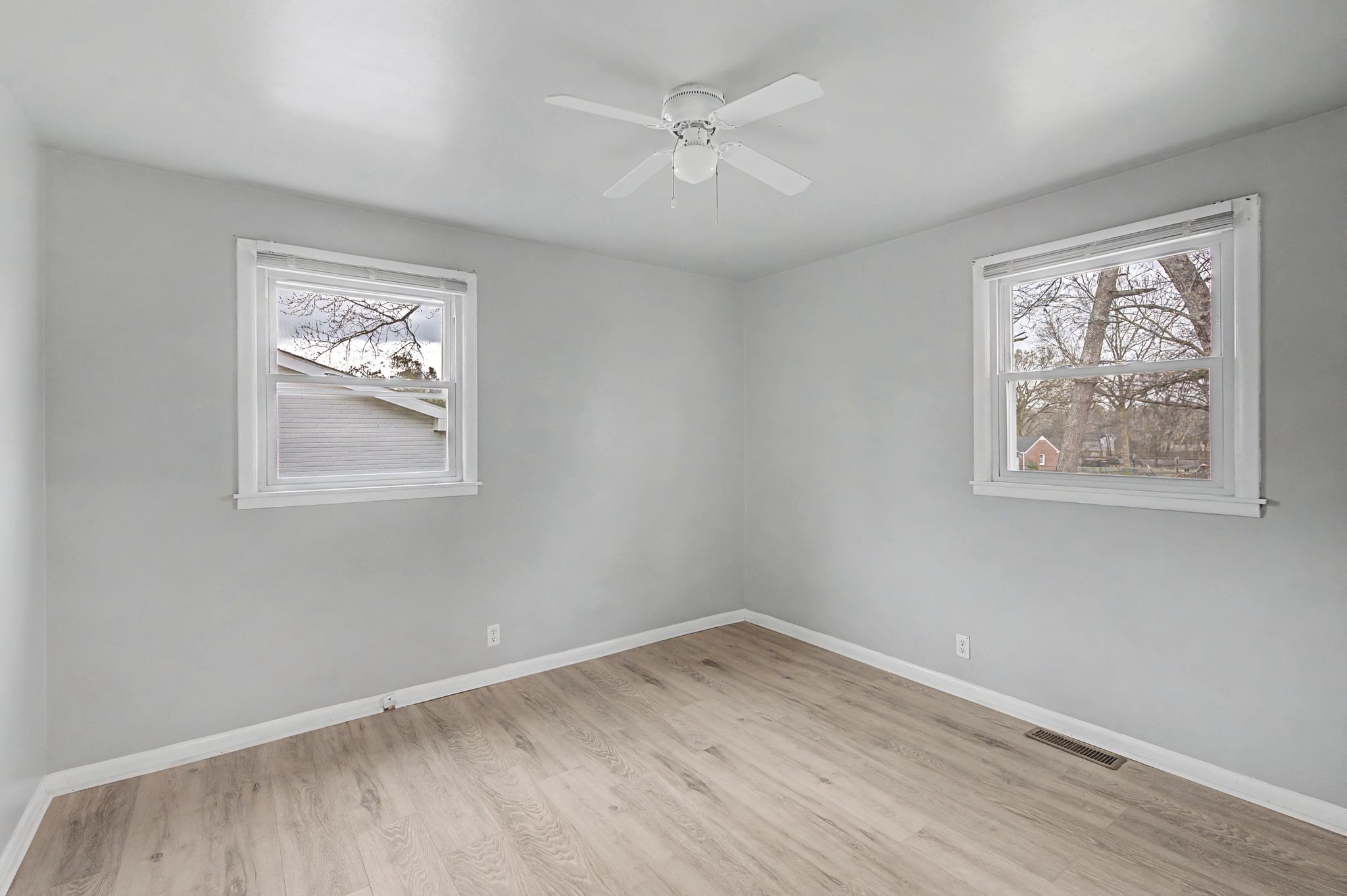 551 Bellevue Road North Nashville, TN 37221 - Photo 24 of 45 a view of empty room with wooden floor and ceiling fan