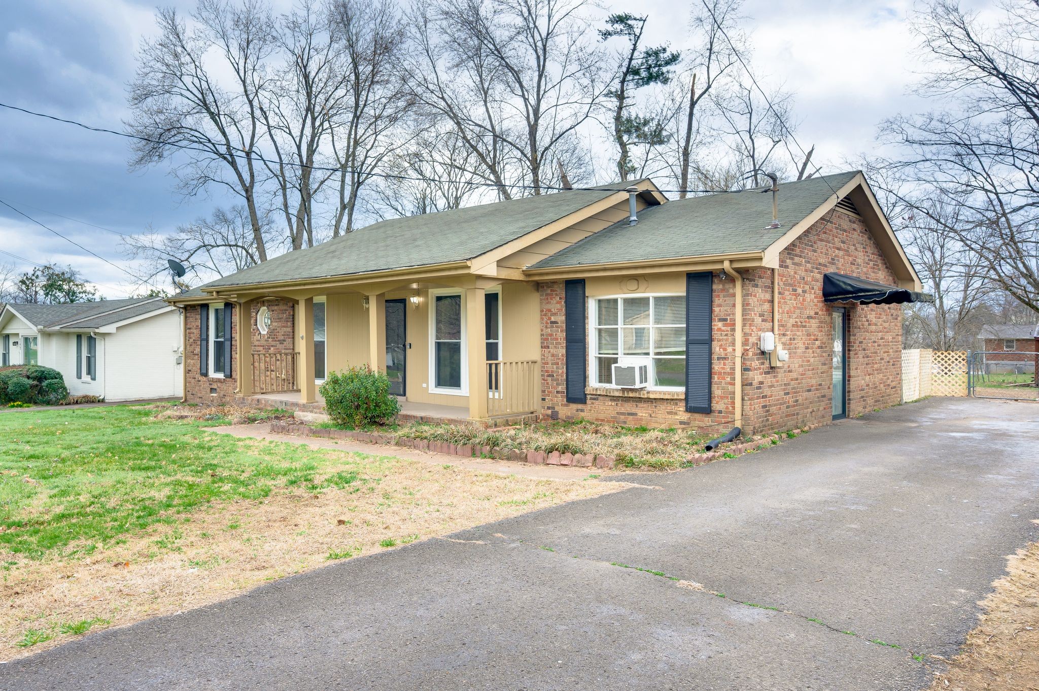 551 Bellevue Road North Nashville, TN 37221 - Photo 3 of 45 a front view of a house with a garden and yard