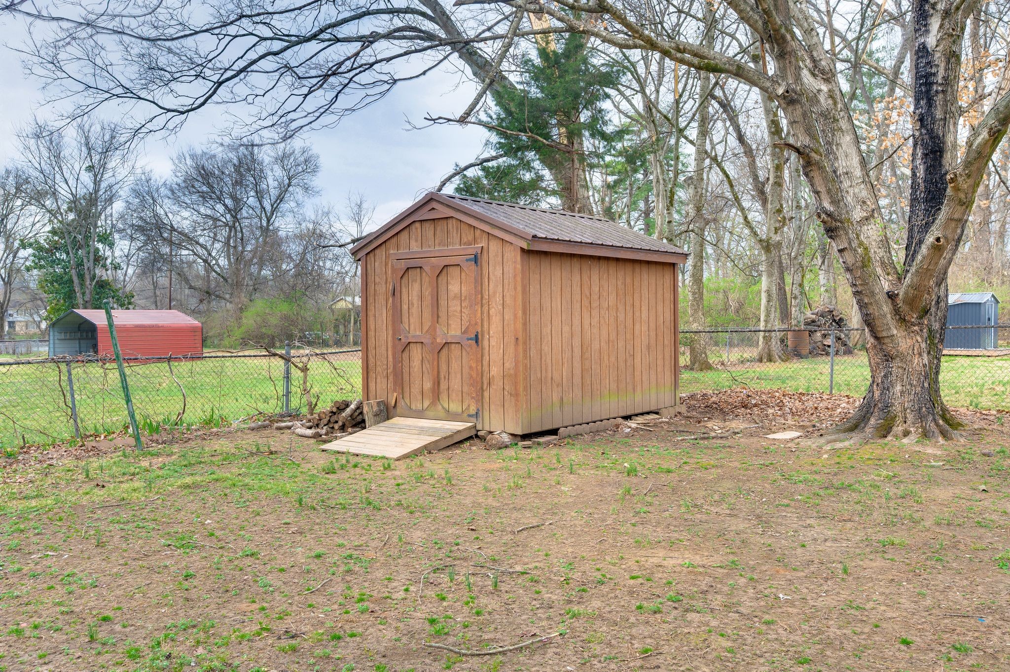551 Bellevue Road North Nashville, TN 37221 - Photo 32 of 45 a backyard of a house with table and chairs
