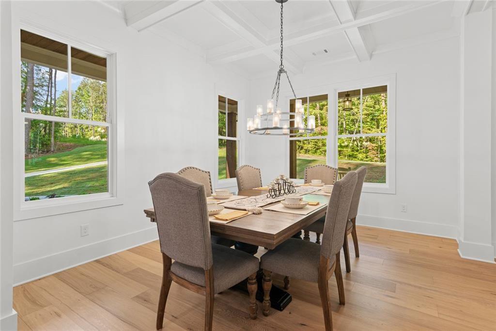 240 Highlands Ball Ground, GA 30107 - Photo 12 of 57 a view of a dining room with furniture window and outside view