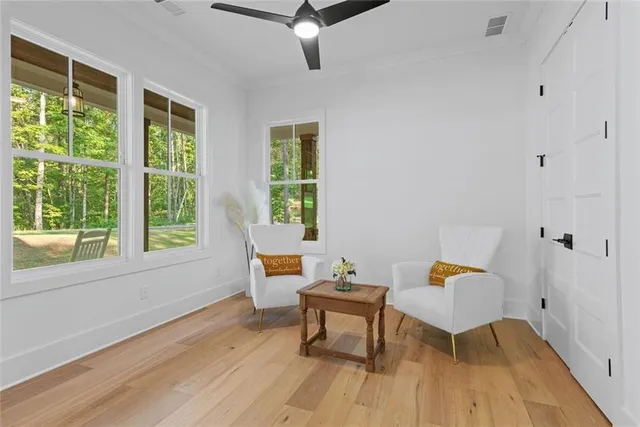 a living room with furniture and a table