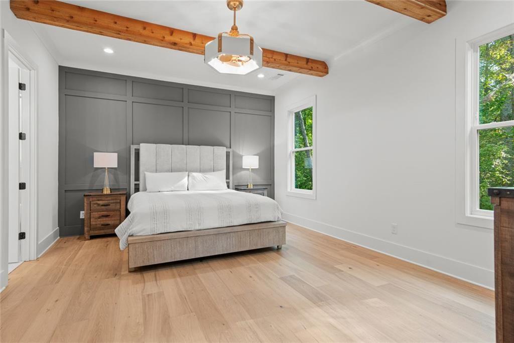 240 Highlands Ball Ground, GA 30107 - Photo 26 of 57 a bedroom with a bed and window