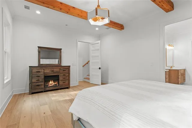a white bath tub sitting next to a shower