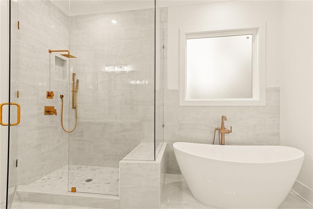 240 Highlands Ball Ground, GA 30107 - Photo 32 of 57 a white bath tub sitting next to a shower