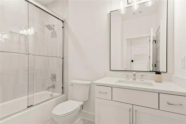 a bedroom with furniture and a large window