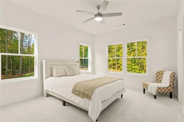 an empty room with windows and cabinet