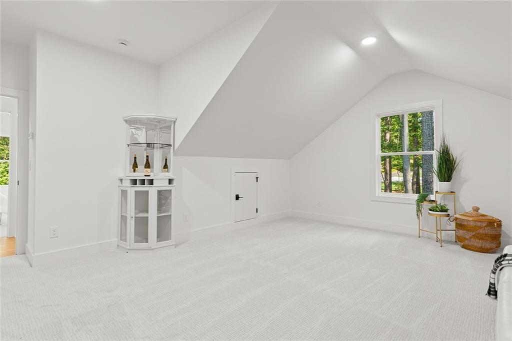 240 Highlands Ball Ground, GA 30107 - Photo 43 of 57 an empty room with windows and cabinet