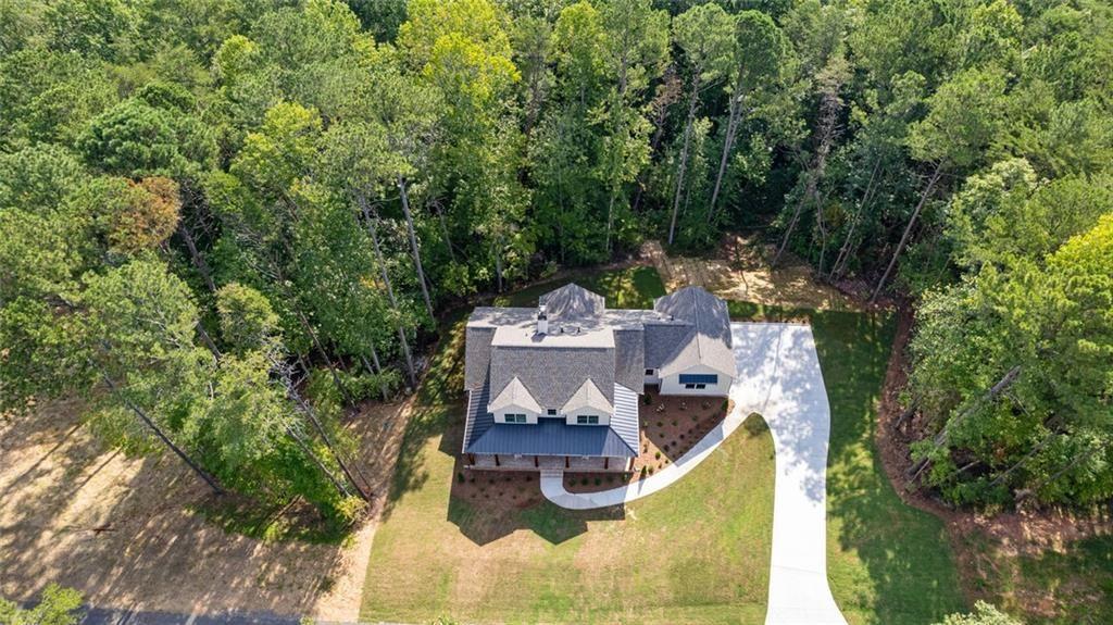 240 Highlands Ball Ground, GA 30107 - Photo 53 of 57 an aerial view of a house with a garden and lake view