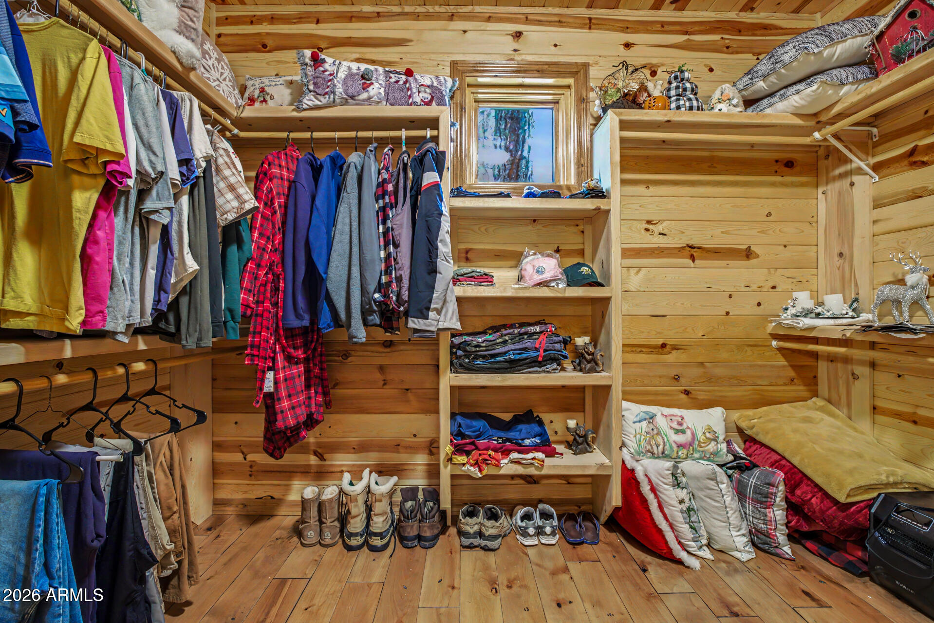 1681 South Jimson Loop Show Low, AZ 85901 - Photo 32 of 105 a view of walk in closet with clothes and shoes