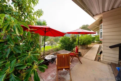 an outdoor space with furniture and umbrella