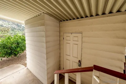 a view of balcony with wooden floor and stairs