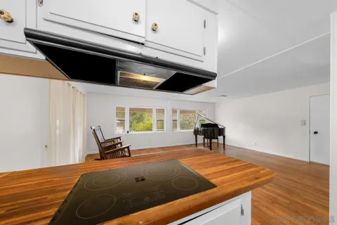 a bed sitting in a room next to a window