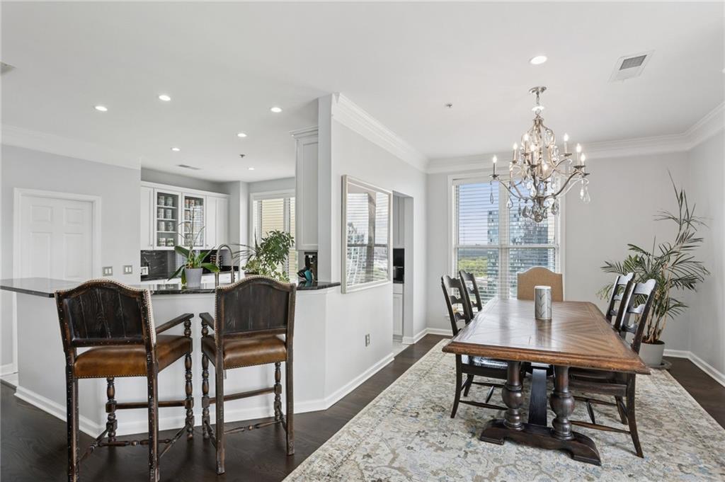 3334 Peachtree Road Northeast, Unit 1908 Atlanta, GA 30326 - Photo 11 of 46 a view of a dining room with furniture and chandelier