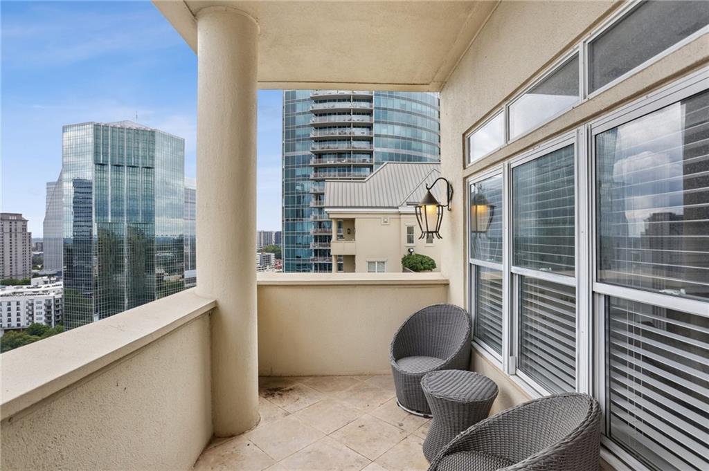3334 Peachtree Road Northeast, Unit 1908 Atlanta, GA 30326 - Photo 16 of 46 a balcony with table and chairs