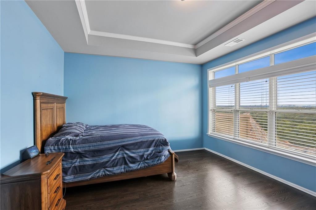 3334 Peachtree Road Northeast, Unit 1908 Atlanta, GA 30326 - Photo 22 of 46 a bedroom with a bed and a window
