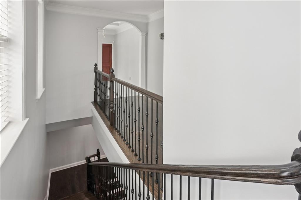 3334 Peachtree Road Northeast, Unit 1908 Atlanta, GA 30326 - Photo 23 of 46 a view of a hallway with wooden floor and staircase