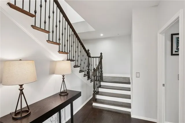 a view of entryway and hall with wooden floor
