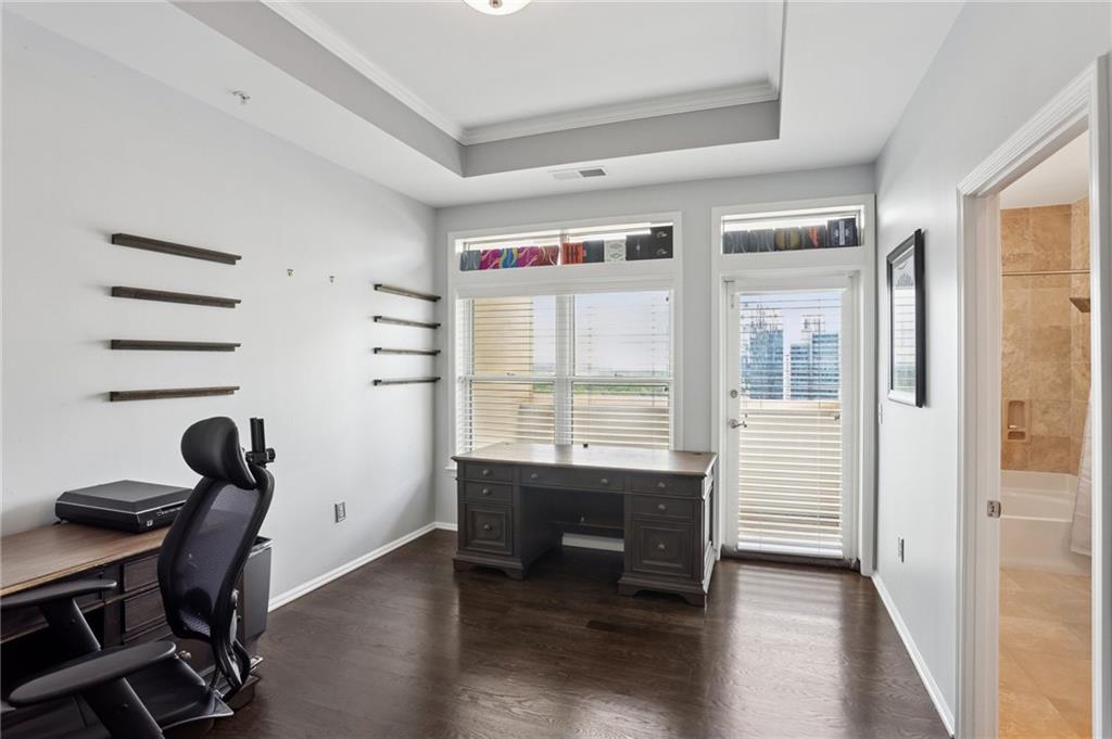 3334 Peachtree Road Northeast, Unit 1908 Atlanta, GA 30326 - Photo 25 of 46 a view of a workspace with furniture and a window