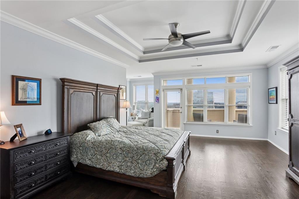 3334 Peachtree Road Northeast, Unit 1908 Atlanta, GA 30326 - Photo 28 of 46 a bedroom with a large bed and a window