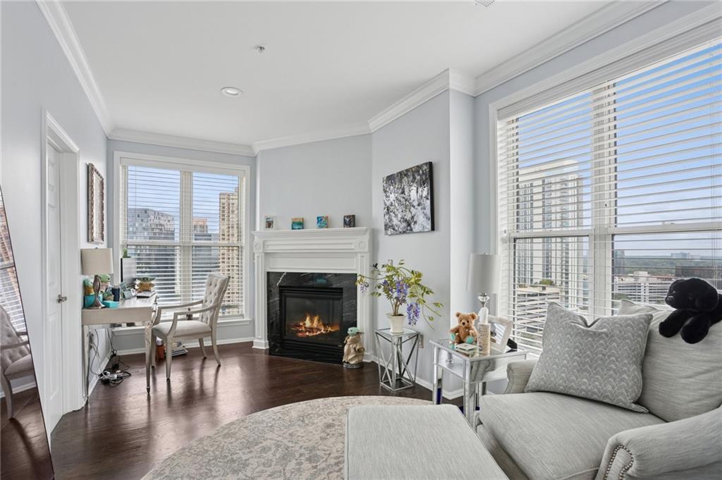 3334 Peachtree Road Northeast, Unit 1908 Atlanta, GA 30326 - Photo 29 of 46 a living room with furniture and a fireplace