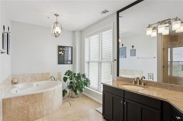 a bathroom with a bathtub and shower