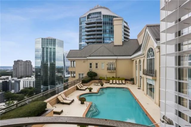 a dinning table and chairs in the patio of the house
